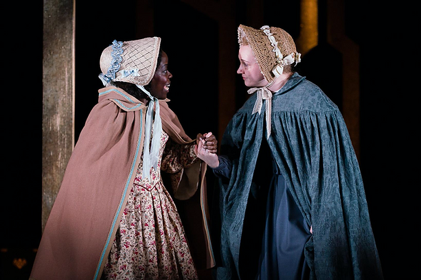 Two women leaving towards each other and holding hands