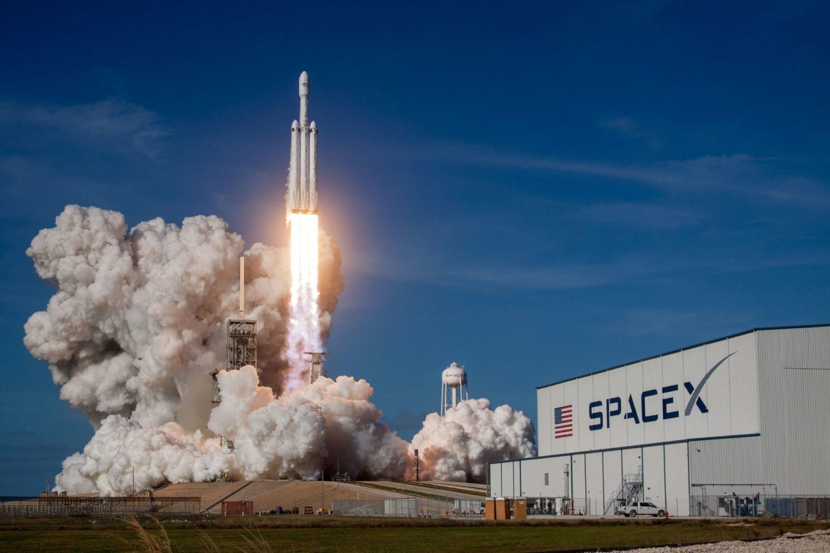 A SpaceX rocket launches in the day