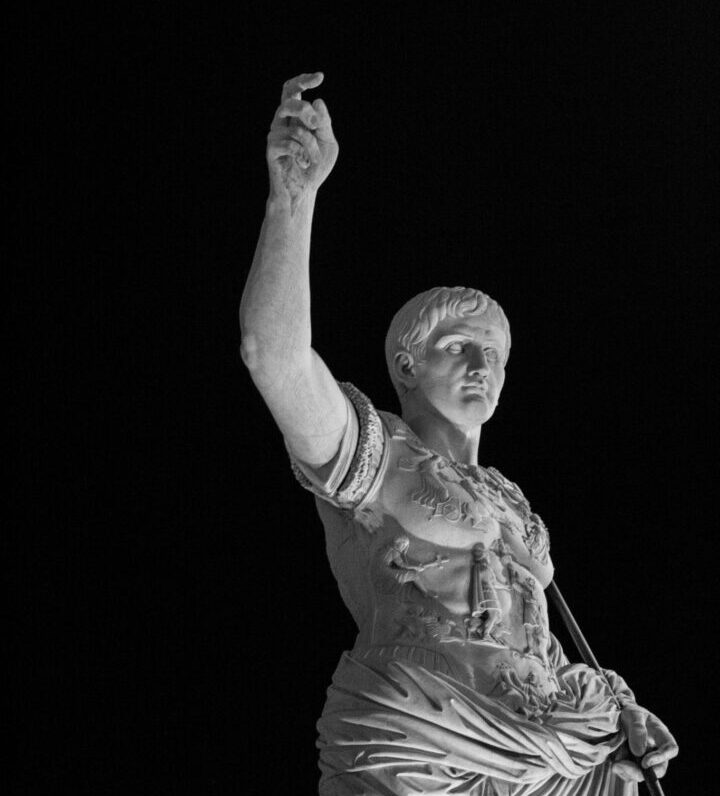 a black and white photo of a statue of Augustus Caesar